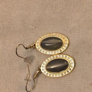 Earrings with charcoal color cats eye center.